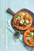 'sole mio' potato pan pizza with tomatoes, rocket and mozzarella