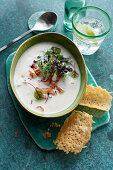 Cream of potato soup with bacon and cress