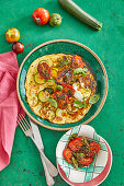 Spicy courgette omelette with roasted tomatoes