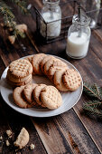 Peanut butter cookies on a white plate in rustic style
