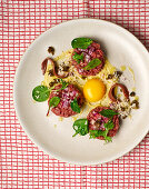 Steak tartare with egg and fried capers