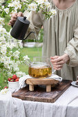 Pouring boiling water into a teapot