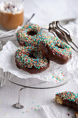 Vegan donuts with chocolate icing and sugar sprinkles