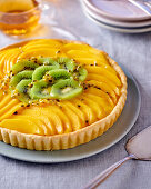 Mango and kiwi tart with passion fruit