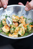 Marinate shelled prawns in oil and herbs