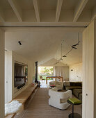 Bright living room with billiard table in the background