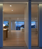 View through open door into elegant living room at dusk