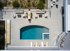 View from above of sunny terrace with pool