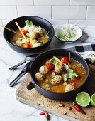 Spiced chicken meatballs in hot and sour soup