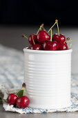 Red cherry in a white ceramic box