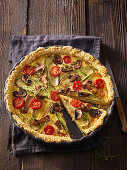 Mushroom quiche with courgettes and cherry tomatoes