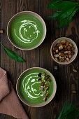 Vegan wild garlic soup with coconut milk and croutons