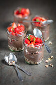 Yoghurt chocolate mousse with spelt and strawberries