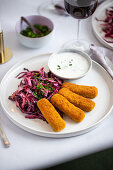 Breaded vegetable sticks with red cabbage salad