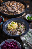 Chicken in mushroom sauce, mashed potatoes and red cabbage