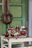 Homemade decorated jars with pine cones for gift jars