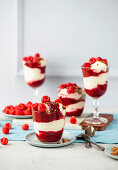 No-bake cheesecake in a jar with raspberries and honey