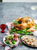 Roast turkey with herb butter, prosciutto and pear stuffing