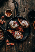 Baked pears with cinnamon, coconut cream and pecans