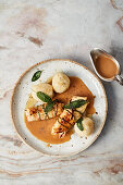 Vegan celeriac roulades with potato dumplings and beer sauce