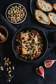 Baked feta with figs, rosemary, pistachios and honey