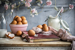 Baking ingredients and old cookery book