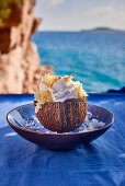 Coconut dessert in half coconut by the sea
