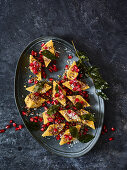 Indian khaman dhokla loaves with pomegranate seeds