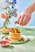 Pancakes with fresh fruit and honey