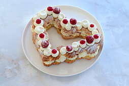Choux pastry heart with vanilla-chocolate cream cheese cream and raspberry confit