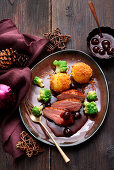 Duck breast with amarena sauce and potato dumplings