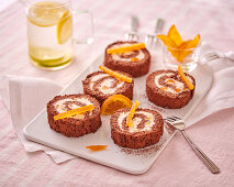 Chocolate sponge roulade with candied oranges