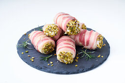Salty bacon 'cannons' with pistachios