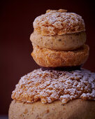 Two different sized Religieuses with nut cream and crumble