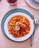 Veal rolls on pasta with tomato sauce