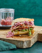 Roast pork in a sandwich with pickled horseradish onions