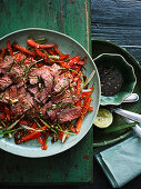 Thau-style beef salad with lime leaves and chillies