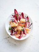 Chicory salad with pomelo, scallops and wild herbs