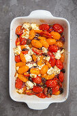 Date tomatoes with feta and black olives from the oven