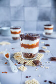 Layered caramel dessert whipped cream and chocolate