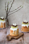 Kulich with candied fruits decorated with chocolate nests and sugar eggs