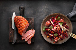 Smoked duck breast with red cabbage and pear salad, cranberries and pecans