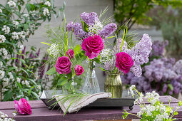 Bouquet of lilac (Syringa Vulgaris), rose (Rosa) 'Fräulein Maria', wild garlic flowers and woodruff in vases on garden bench