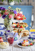 High tea with sweet pastries and sandwiches