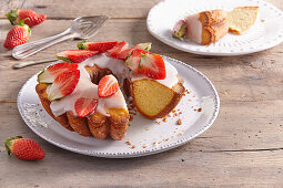 Donut cake with icing and strawberries