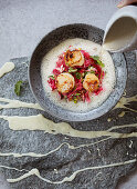 Fried scallops on beetroot sauerkraut with chilli