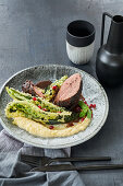 Veal fillet in a cardamom and cocoa coating with pomegranate and mint sauce