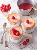 Raspberry soufflé with raspberries and icing sugar