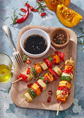 Vegetable skewers with pumpkin, tofu, sesame seeds and soya sauce