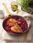 Roasted pork chops with beer sauce and red cabbage